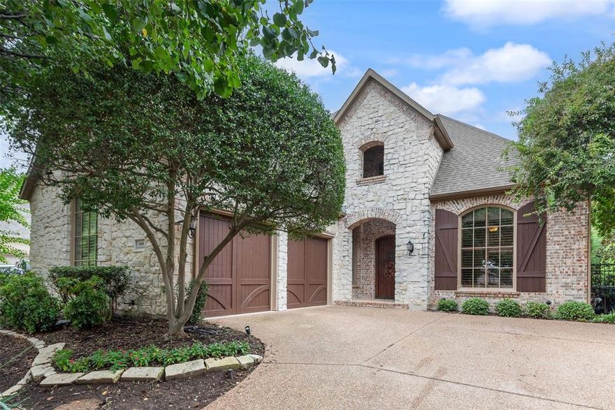 This stunning 3-bedroom, 2.5-bath Southlake home offers timeless elegance and beautiful curb appeal featuring Austin stone. Inside, crown molding, wood shutters, and designer finishes create a warm and inviting feel throughout. Off the impressive two-story entryway, you’ll find a formal dining room perfect for entertaining and an executive study featuring built-in bookshelves and a coffered ceiling. The spacious living room centers around a gas fireplace and custom built-ins, opening seamlessly to the kitchen—an entertainer’s dream with a large center island, breakfast bar, built-in refrigerator, double ovens, gas cooktop, dual sinks, and skylights that flood the space with natural light. A convenient wet bar adds to the home’s appeal for hosting family and friends. The serene primary suite offers a relaxing jetted tub, dual vanities, separate shower, and a spacious walk-in closet. Providing privacy and comfort for guests and family, the two secondary bedrooms are upstairs and each feature walk-in closets and share a Jack-and-Jill bath. An enclosed patio allows for year-round enjoyment, while the outdoor space offers a patio for grilling and a low-maintenance yard with lush landscaping. Nestled in the prestigious Timarron community, residents enjoy resort-style amenities including two pools, fitness center, tennis and pickleball courts, basketball and volleyball courts, playgrounds, two clubhouses, fishing pond, and scenic walking trails with gazebos and arbors. Timarron is also home to the renowned Byron Nelson–designed golf course at Timarron Country Club, available with membership. Unbeatable location—just minutes from Southlake Town Square for world-class shopping, dining, and entertainment.