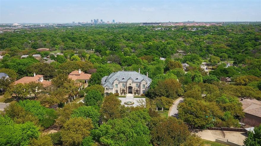 AUCTION - Seller offering property via online auction. Bid online beginning Monday, April 24th with a starting bid of $2,500,000. Open house begins on Friday, April 21st. Incredible opportunity to purchase this Traditional French-style Custom Home situated on 1.82 acres in SW Ft Worth. Very hard to find Hilltop VIEWS of TCU stadium and downtown with complete privacy! So many extras including pool and pool house constructed with limestone and imported slate roof, highly customized movie theater with 12 seats, Lutron & Crestron electronics systems, 4,000 sf of floored attic space - could easily be made into living space 3rd floor. Owners suite on 1st floor with his 'n her baths, elevator services all 3 floors, full-size exercise room could be 5th bedroom with sauna, 5 car garage. More property details in Transaction Desk.