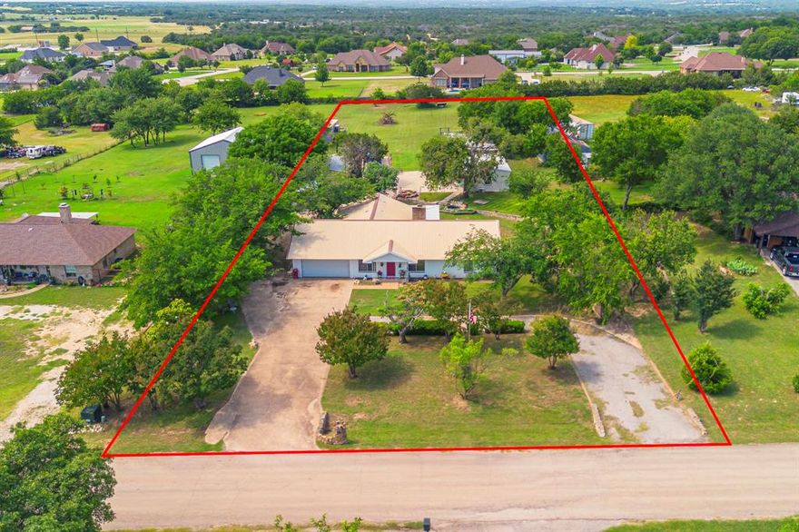 Welcome to 1978 Hill Top Circle, a one-of-a-kind property offering multiple living spaces, expansive parking, and incredible versatility.
The main house is spacious and currently configured as a two-bedroom, two-bath layout, with an additional flex room off the heated and cooled sunroom patio. A third bedroom can easily be restored by adding a wall, providing flexibility for families or guests. In addition to the main residence, the property includes three separate structures. One is a fully equipped one-bedroom, one-bath guest house with a full-size kitchen—ideal for multi-generational living or rental income. There is also a large metal building that could easily be converted into a two-bedroom apartment or used as a workshop, home business, or studio space. A third metal structure with a covered area offers additional storage or workspace. The exterior is equally impressive, featuring enough concrete parking to accommodate up to 22 vehicles and full RV hookups located at the back of the property. Whether you're seeking multi-generational living, rental potential, or a place to run your business from home, this unique property delivers exceptional opportunity and space.