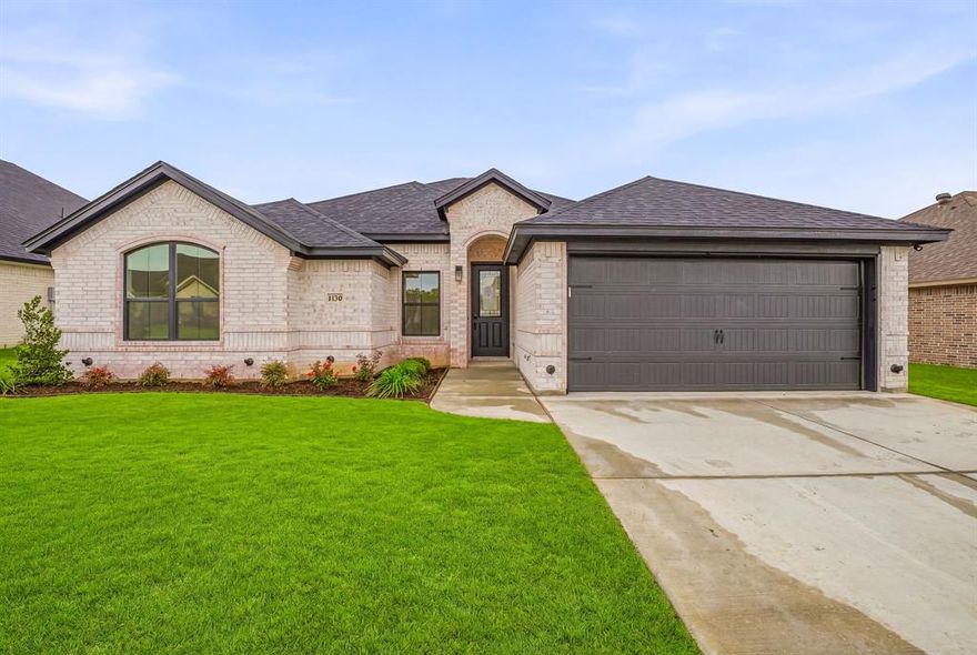 Welcome to 1130 Wild Rose Drive, a new construction home by Al Couto Homes located in The Parks of Tolar. This 4-bedroom, 2-bath home with a 2-car garage offers an open-concept layout designed for everyday living.

The kitchen overlooks the living and dining areas and includes granite countertops, ample cabinetry, and functional workspace. The living room features a fireplace, crown molding, and natural light. Wood-look ceramic tile flooring is installed throughout the main living areas.

The split-bedroom arrangement separates the primary suite from the secondary bedrooms. The primary bedroom includes an ensuite bath with dual sinks, garden tub, separate shower, and walk-in closet. Secondary bedrooms provide flexibility for a variety of uses.

Exterior features include a covered patio and fenced backyard. Additional features include built-in cabinetry and an attached 2-car garage.

Located in The Parks of Tolar within Tolar ISD.