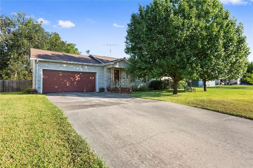 You keep asking for THIS, and here it is!  Don't judge a book by its cover. This adorable home is so much bigger that it looks from the road.  Way too cute 3/2/2 at the edge of town sits in the perfect location for family, fun, and an easy commute to Waco or Groesbeck.  Den/family room could be 4th bedroom, or enjoy two large living areas.  Large, shaded, fenced back yard is perfect for your kiddos and your fur-babies.  Inside, you'll find three spacious bedrooms, two full baths, formal dining area, and a lovely kitchen with tons of cabinets and counter space.  Priced to sell and ready to be called HOME.