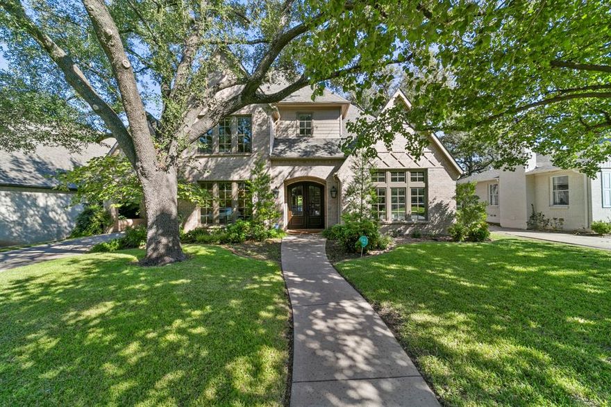 Warm, inviting, gorgeous Preston Hollow beauty. This open concept home is special with natural light flowing throughout. Many upgrades & features… paint, extensive hw flooring, hw circulator, gutter guards, 2 mudrooms, 2 staircases, walk-in closets throughout, & 3-car garage with porte corchere. Large kitchen with lots of cabinets & counter space, walk-in pantry, commercial grade oven & vent with gas cooktop, & built-in refrigerator. Huge island with vegetable sink & plenty of room for gathering in the kitchen. Butler's pantry with wine cooler & extra storage. Downstairs offers master suite, guest suite with en-suite bath, 2 half baths & study. Upstairs features 4 bedrooms, 2 baths, & large game room. One bedroom is perfect as second game room or second office. Electric gate from the alley. Great location. Less than one block from Preston Hollow Park. Close to downtown Dallas, Northpark, highly rated restaurants, multiple hospitals & private & public schools. This is the sweet spot!