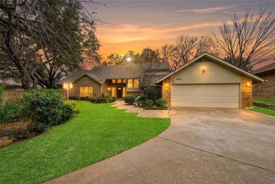 Experience golf course living at its finest in this exceptional gated estate, positioned on the #1 green of Ridglea Country Club. With sweeping fairway views, unforgettable sunsets, and the clubhouse just moments away, this home delivers a lifestyle centered around convenience, recreation, and prestige with no HOA. Designed for both comfort and flexibility, this home features a private downstairs primary suite with patio access and a secondary ensuite bedroom, ideal for guests or multigenerational living. Upstairs, a spacious bedroom with private balcony and bath is complemented by an expansive bonus room perfect for a media space, office, or additional bedroom. Outdoor living is elevated with mature trees, a balcony, and two patios, all overlooking the course to create a seamless indoor outdoor experience. The property is fully enclosed with a brick privacy wall and enhanced by motion activated automatic exterior accent lighting, and a monitored ADT security system in place through Feb 2028. Recent updates include wood flooring, new carpet, marble finishes, fresh paint, and all new windows throughout. The kitchen has been updated with quartz countertops, stainless steel appliances, updated sinks and fixtures, and a built in microwave. Additional highlights include skylights, a wet bar, wood burning fireplace, zoned HVAC, LED lighting with dimmers, sprinkler system, covered gutters, exterior storage, oversized two car garage, and additional parking. Located within walking distance to tennis courts, pickleball, the pool, shopping, dining, and essential services, this home offers unmatched accessibility in one of Fort Worth’s most established golf course communities. Special owner financing is available at 4.9 percent with a 3 or 5 year call on a 30 year amortization, creating significant monthly savings and saving buyers thousands compared to current market rates. This is a rare opportunity to secure a premier golf course property with exceptional terms.