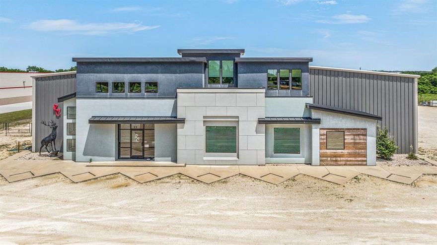 Welcome to a rare modern commercial property located in Stephenville, TX with approx 280 ft of hwy frontage on Hwy 281. This exceptional property sits on 3.2 acres and with its attractive facade and strategic placement, your business is sure to stand out. The open design invites collaboration and productivity with 4,220 SF of sleek, glass office space. Efficient with 4 offices, reception area, showroom, kitchen, and restrooms on the 1st floor. On the 2nd floor is an Exec office, addtl conference room, storage rooms, restroom. Spanning an impressive 23,312 SF the warehouse space is designed for productivity. 5 workspaces currently utilized for paint, welding, shipping, tools; some equipped with commercial ventilation including a spacious manufacturing area, breakrooms, and restrooms cater to the needs of your workforce. Seamlessly manage logistics with a loading dock, 2+ roll ups and 2,000 SF of separate storage behind the warehouse. This property is customizable to meet your needs.