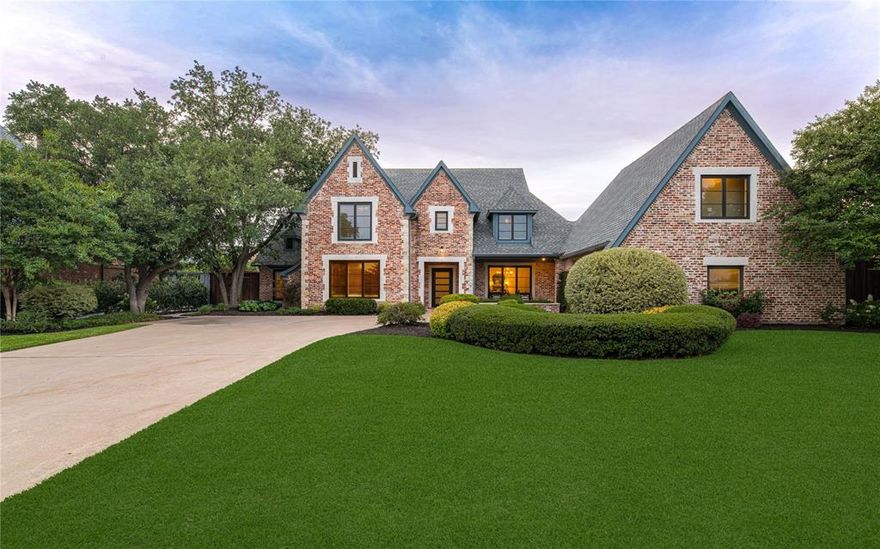 Situated on a rare half-acre lot in the heart of Preston Hollow, this beautifully updated home blends timeless design with modern comfort. Just across from St. Mark’s School, the location is as prestigious as it is convenient. Originally built in 1997 and updated in 2023, the home offers an open, light-filled layout with a spacious kitchen and family room at its center. Large windows bring in natural light and offer views of the lush backyard. A formal dining room and multiple living areas on the main floor make it ideal for both everyday living and entertaining.The first-floor primary suite is tucked away for privacy, featuring a luxurious bath and generous closet space. There’s also a dedicated office with custom built-ins and French doors—perfect for working from home. Upstairs, you'll find three large bedrooms, each with its own en-suite bath, plus a flexible game room that works great as a playroom, media space, or studio. An elevator makes moving between floors effortless. Outside, the backyard feels like a private retreat, complete with a resort-style pool, mature trees, and colorful landscaping. Just a short stroll to Preston Royal’s shops and restaurants, this home offers the perfect balance of space, style, and location.