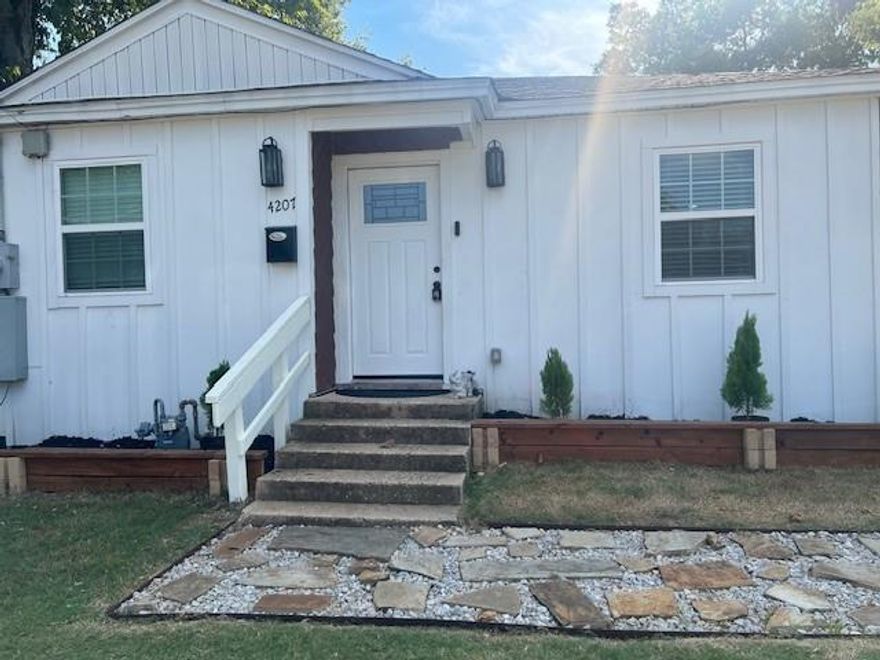 WHITE FRAME HOUSE WITH NICE FRONT LANDSCAPING.HAS SMALL PINE TREES PLANTED IN FLOWERBED IN FRON OF HOME ON BOTH SIDES OF THE DOOR.THE HOME HAS BEEN COMPLETELY REMODELED AND IT HAS THE SELLERS SPECIAL TOUCHES ON THE PROPERTY.THE HOME HAS OPEN KITCHEN LIVING AREA AND DINING AREA ALL IN ONE SIDE OF THE HOME ITS VERY SPACIOUS YOU WILL LOVE IT IT IS BRIGHT AND SPACIOUS HAS 2 BEDROOMS IN FRONT OF HOME AND A BATHROOM THE MASTER BEDROOM IS IN THE BACK OF THE HOME IT ALSO  HAS A LARGE BATHROOM CUSTOM BUILT MUST SEE TO APPRECIATE IT HAS A HARDWOOD LAMITE FLOORING IN LIVING AND DINING AND KITCHEN AREA AND TILE IN BEDROOMS AND LARGE MASTER BEDROOM WITH A LOVELY COMPLETE MASTER BATHROOM MUST SEE  TO APPRECIATE VERY UPGRADED FEATHERS                                                                                                                                                                                                    
HAS STAINESS STEAL APPLIANCES AND STAINLESS STEEL SINK IN KITCHEN ,