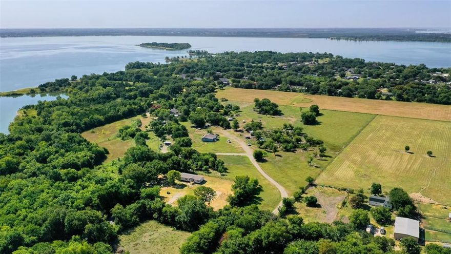 Rare and Unique Opportunity Near Lake Lavon! This is a rare chance to own 13.4 acres of beautiful, gated land just minutes from Lake Lavon. Whether you're looking to build your dream home, develop multiple residences, or simply enjoy the space as it is, this property offers endless potential. With five septic systems already in place, it's an excellent opportunity for developers or those seeking multigenerational living.
The recently remodeled home, updated in 2023, features 2,120 square feet of spacious and flowing living space. It offers three large bedrooms and two full bathrooms. The living room is expansive and welcoming, complete with built-in shelving. The eat-in kitchen includes a breakfast bar, plenty of cabinetry and counter space, and opens to a formal dining room perfect for entertaining.
The primary suite boasts two walk-in closets and a private ensuite bath. The second bedroom also includes a walk-in closet, and the home offers a large utility room with built-in cabinets for added storage.
Additional highlights include RV parking, two storage sheds, and a guest house on the property, providing even more flexibility and space. Whether you're looking for peaceful country living or a unique investment, this one-of-a-kind property delivers.