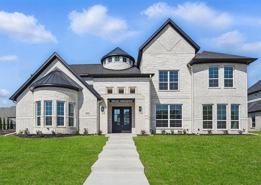 Introducing the most majestic newly built home located in the highly sought-after luxury neighborhood of Kingsbridge in Wylie This home features 5 bedrooms with 3 Main Suites on ist floor; 4th Main Suite on 2d Floor; 5.5 baths, office, media, family & game rooms, 3 living areas, formal dining room, 2 kitchens - main kitchen & hot kitchen, mud room & 3 car garage. Facing East on a third of an acre, this luxury residence includes a grand entrance with high-end white-gray porcelain; white oak hardwood flooring, quartz granite top in both kitchens, hardwood spiral staircase, & marble top vanities & state of the art kitchen stainless steel appliances. The Family Room showeases a tiled floor-to-ceiling gas fireplace.