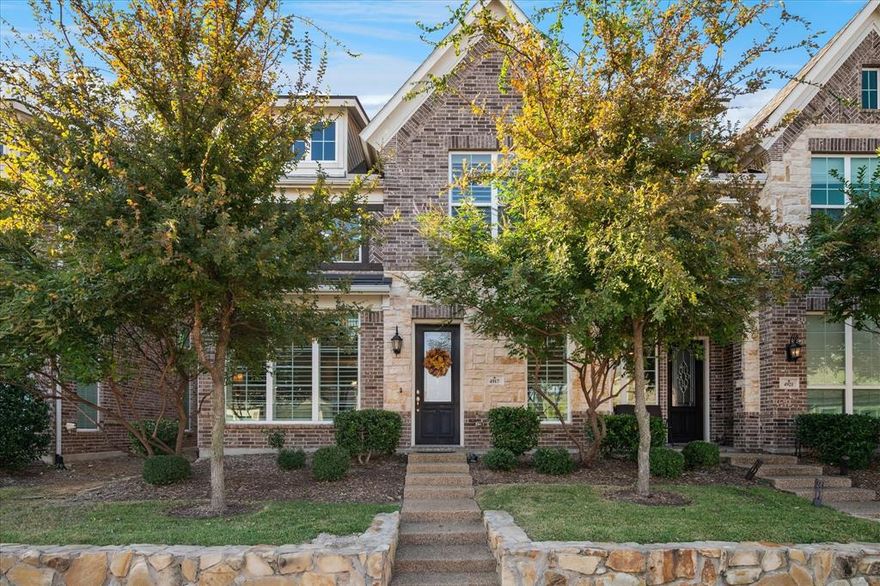 Welcome to this beautifully appointed 4-bedroom, 3.5-bath townhome that blends comfort, style, and functionality. Featuring a striking brick and stone elevation and landscaped front yard, this home offers incredible curb appeal from the start. Step inside to discover an open-concept layout with tall ceilings and tons of natural light that floods the main living area. The wrought iron staircase adds a touch of elegance, while the second-floor overlook gives the space an airy, architectural feel. Upstairs, a spacious flex space provides endless possibilities for a game room, home office, or media lounge. The heart of the home is the gourmet kitchen with granite countertops, complete with a large island, stainless steel appliances, gas cooktop, walk-in pantry, and stylish finishes — all seamlessly flowing into the living room for easy entertaining. Retreat to the expansive primary suite, featuring a large walk-in closet and a luxurious en-suite bath with a stand-alone soaking tub, separate shower, and dual vanities. As you walk around, notice the 4 inch plantation shutters! All bedrooms are carpeted for added comfort, and the home includes three full baths and one half bath, ideal for family living or hosting guests. Enjoy your private outdoor living space with a covered back porch on, low-maintenance turf grass, and fully fenced yard, perfect for pets, kids, or quiet evenings outdoors. Additional conveniences include rear parking for easy access and added privacy. Easy access to 121 and 75, and is a perfect lock and leave property. Get in on this assumable 2.5% interest rate 15 year loan! Priced under appraisal value, and with a ridiculously low interest rate this property provides excellent value!