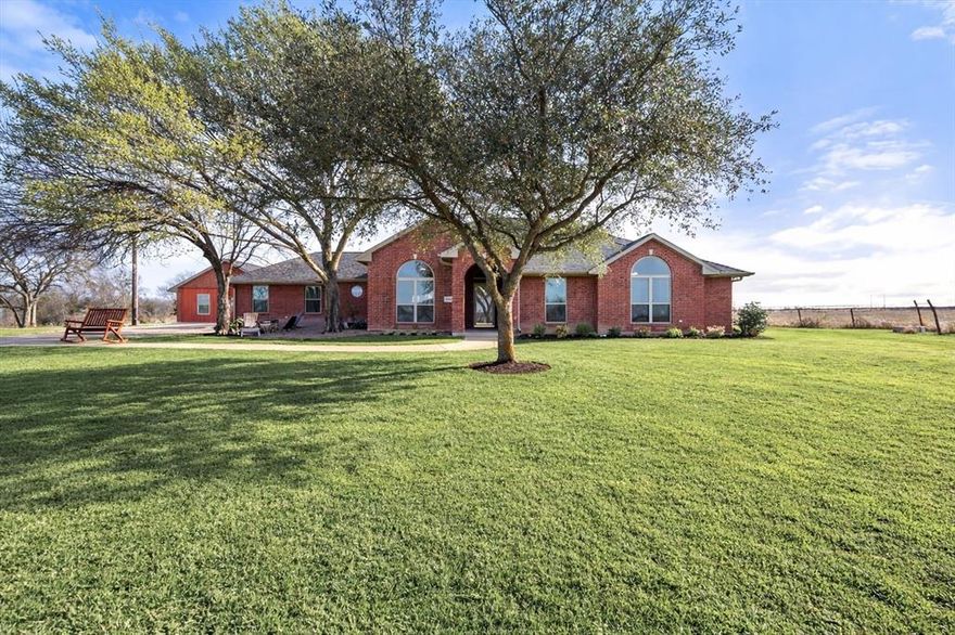 Spacious country living in Mildred ISD near Richland Chambers Lake on 16 acres with room to roam and endless possibilities! This unique property offers a beautifully designed 5-bedroom main home plus a fully equipped studio bungalow and an additional 984 sq ft guest house—ideal for multi-generational living, rental income, or business use. The main home features generous living spaces including a large living room with cozy fireplace, bonus family room, and an expansive dining area perfect for entertaining. The kitchen flows seamlessly for everyday living. The primary suite includes a spa-like bath with dual sinks, soaking tub, & separate shower. Three additional bedrooms include a Jack-and-Jill bath plus a separate hall bath. Fifth bedroom can be used as a home office, playroom, or traditional bedroom! Walk-in pantry & laundry room add everyday convenience. The pool house serves as a private studio apartment with full kitchen, living area, bedroom, full bath, & laundry. The large barn with shop area also includes a separate guest house that has been converted into a successful Airbnb-style space with full kitchen, living room, bedroom, accessible bath, & laundry. Outdoor amenities truly set this property apart: 41x28 shop with electric and 10’ center height, barn, pond, storm shelter, shooting berm, storage buildings, & a two-car carport. The property is fully fenced & already set up for animals, featuring a chicken coop, a pen with a gated enclosure, cattle chute, & a fenced garden area ready to be reclaimed & brought back to life. At the back of the 16 acres, existing infrastructure includes concrete pads, water, & septic already in place for an additional dwelling unit, RV, or a mobile home. With Airbnb income opportunities, extensive workshop space, barn, storage, established animal-ready fencing, & wide-open land to enjoy, this rare multi-use property offers flexibility, functionality, & unlimited potential. A truly one-of-a-kind opportunity in the country!