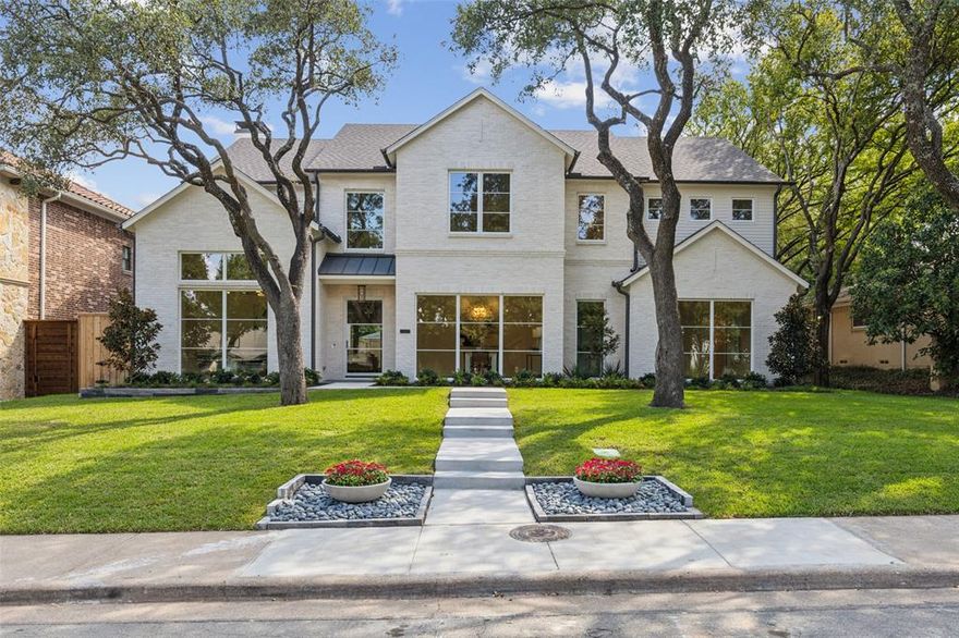 This stunning, newly built Newport Group home is located just blocks from Lakewood Elementary & White Rock Lake. The transitional design features an open floor plan, including formal study & dining room with butlers pantry. The gourmet kitchen boasts white oak cabinetry with reeded glass, premium appliances, quartzite countertops & walk-in pantry. Upstairs, the owner’s suite is a serene escape, complete with a spacious bath with dual reeded white oak vanities, freestanding soaking tub, oversized shower & large walk-in closet connected to the upstairs laundry. Two additional upstairs bedrooms, each with private baths, are complemented by a bright & airy game room with ample storage. Expansive sliding glass doors in the living room open to outdoor living, complete with fireplace & built-in grill. Additional highlights include: 1st floor guest suite with ensuite bath, mudroom, powder baths w luxurious finishes on each floor, board-on-board fence with sliding gate, 2nd floor laundry & more