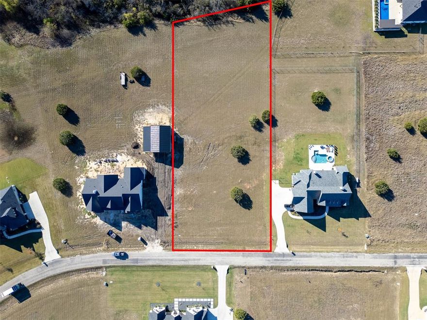 This 1.3-acre lot offers a treed rear fence line for added privacy and plenty of space for a shop, garage, or pool. Featuring oversized concrete roads, underground power, and water at the street (onsite sewage required), this property provides the perfect blend of convenience and privacy. Buyers may bring their own custom plans or choose from the builder’s design, fully customizable to suit their needs. Annual HOA dues are $420, and buyers must provide their own financing. Contact Texan Built LLC, for more information and to start building your dream home today!