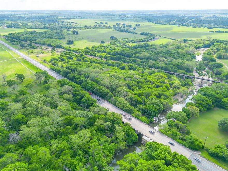Prime Nolan River Frontage on Busy HWY 174 – Over 10 Acres with Fireworks Stand! Incredible investment opportunity! This 10+ acre property boasts coveted frontage along the beautiful Nolan River and prime exposure on highly trafficked HWY 174 in Blum, TX. The land offers versatile potential for commercial or recreational use, with an existing fireworks stand in place and excellent visibility for passing traffic. Whether you’re looking to expand a business, build your dream getaway, or invest in a unique riverfront location, this property delivers. Don’t miss your chance to own a rare piece of riverfront land with high visibility and endless possibilities.