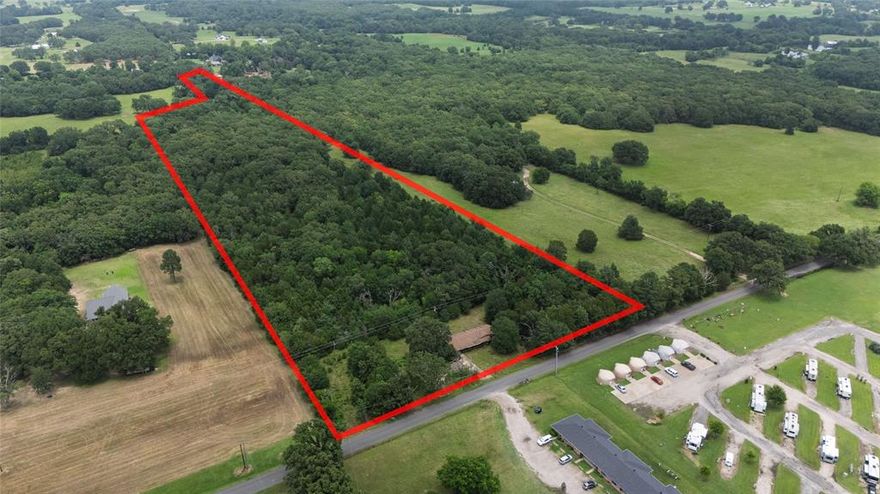 If you're looking for privacy, space, and potential—this 15.35-acre wooded property just outside the Grand Saline city limits could be the perfect fit. Tucked away in a quiet rural setting, this versatile tract features mature trees, natural beauty, and room to create your ideal country escape.

The property includes a manufactured home, an attached carport, and a storage building. The condition of the home is unknown and it is being sold as-is, making it ideal for buyers looking to renovate, replace, or build new. Electricity is available, and existing improvements offer a head start for development or recreational use.

With plenty of road frontage and no city taxes, this unrestricted acreage offers flexibility for homesteading, weekend use, or investment. Wildlife and privacy abound in this peaceful East Texas setting.

Located just minutes from the amenities of Grand Saline and within 90 minutes of Dallas, this property combines rural charm with convenience.

Schedule your showing today and explore the possibilities this land has to offer!