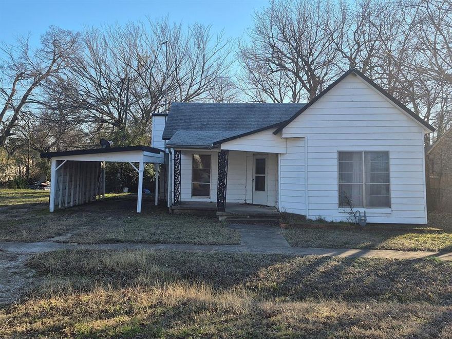 ATTENTION INVESTORS, FLIPPERS, AND BUILDERS: This is the math-making project you have been waiting for in Whitewright. Priced aggressively at $94,900, this package includes a 1,233-square-foot historic 1910 cottage PLUS an adjacent 0.163-acre buildable lot with its own parcel ID (0.326 acres total). This property is being sold strictly AS-IS and is a prime candidate for a full cosmetic and systems overhaul. Whether you are looking for your next fix-and-flip, a long-term rental hold, or a multi-phase development project, the margins and exit strategies here are undeniable.

The existing home features classic Texas cottage bones with a covered front porch, an attached carport, and a spacious layout that includes a converted great room with an original fireplace mantle. The interior currently features vintage wood paneling, a large eat-in kitchen footprint, and a combined utility and bathroom space that is ripe for reconfiguration. The property requires significant TLC, including roof evaluation, ceiling repairs, kitchen and bath gutting, and flooring, making it ideal for a seasoned contractor or cash buyer ready to get their hands dirty.

The true X-factor is the extra lot. You have the flexibility to renovate the existing structure and sell the package, hold the home as a rental while building new construction next door, or split the parcels to maximize your return on investment. The property is connected to city water and sewer. Located just blocks from downtown Whitewright and local schools, the location offers strong resale or rental demand once completed.

Do the math - With recent renovated sales in Whitewright pushing well past $150 per sq ft, the ARV potential on the existing home alone leaves plenty of meat on the bone, let alone the value of the vacant lot. Cash or conventional financing only. No blind offers. Bring your contractor, run your numbers, and submit your highest and best. This investor special will not last long at this price point.