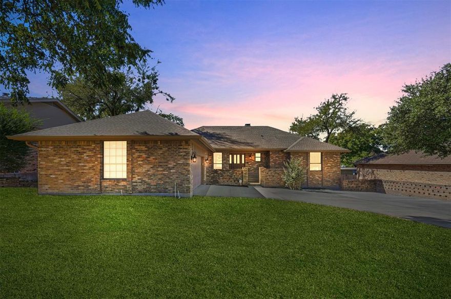 Welcome to your dream home in the lakeside community of Chandlers Landing on beautiful Lake Ray Hubbard. This stunning property has been completely remodeled from top to bottom, blending modern design with warm & inviting spaces perfect for relaxing, entertaining & enjoying lake community living. Once you step inside, you’ll immediately notice the LVP flooring that runs throughout the main living areas, creating a seamless and stylish flow. The spacious open-concept kitchen is a showstopper & is designed for entertaining and everyday living, featuring granite countertops, an abundance of custom cabinetry for storage, a large center island with seating and stainless steel double ovens, perfect for holiday dinners or casual get-togethers. The primary suite is truly a retreat on the main floor. The spa-like ensuite bathroom features a massive walk-in shower, dual sinks and open shelving on either side of the shower for both function and style. You’ll also love the large walk-in closet with ample space for storage and organization. Step outside to your private covered balcony and enjoy your morning coffee or unwind in the evening while soaking in peaceful views of the neighborhood. Every inch of this home has been thoughtfully updated—offering the perfect blend of luxury, comfort and functionality. From the open-concept layout and beautiful finishes to the multiple outdoor living spaces, this home is ready for you to move right in & start enjoying all that lakeside living has to offer. This guarded community provides peace of mind & an abundance of amenities, including two community pools, two tennis courts, private streets, wooded parks, walking trails, greenbelts, and even an on-site restaurant and marina. Whether you love boating, walking along scenic trails, or simply enjoying a close-knit neighborhood, this community has it all. Don’t miss your chance to experience this completely renovated home in Chandlers Landing on the shores of Lake Ray Hubbard.