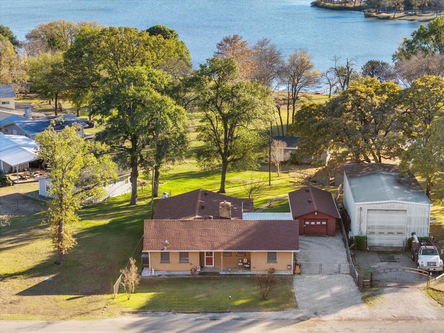 **LAKEFRONT UNDER 350K!!**One-Owner LAKEFRONT Gem on Lake Tawakoni!**
Nestled on a quiet, secluded road with direct waterfrontage and a boathouse, this beautifully maintained brick home offers the perfect blend of comfort, privacy, and lake living. Featuring two primary bedrooms, three full baths, and a spacious living area, the layout is ideal for full-time living or weekend getaways.

Step outside to a large backyard leading straight to the water, complete with a private boathouse, making lake days effortless. The home is move-in ready and has been well cared for, with a newer roof, newer HVAC system, and a lush, beautifully kept yard that reflects true pride of ownership.

While already comfortable and inviting, a few updates could easily transform this property into the ultimate Lake Tawakoni dream retreat. Whether you’re seeking a peaceful primary residence, a second home, or an investment in lakefront living, this property delivers location, lifestyle, and long-term potential.

Rare one-owner custom-built lakefront opportunity—don’t miss it. The construction of the primary build of this property features cinderblock walls on the interior making it sturdy and energy efficient! Would make an excellent STR since the community features a boat launch.The backroom could easily be converted to a bunk room with built-in beds and the third bath and large closet adjacent!