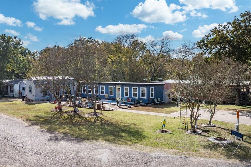 Welcome to your own little piece of paradise near Cedar Creek Lake! This charming and impeccably maintained property offers comfort, versatility, and peaceful living in a quiet neighborhood just minutes from the lake, shopping, restaurants, and more. The main home features 640 sq ft of well-designed living space, including 1 bedroom and a full bath with stackable washer and dryer. The spacious kitchen and living area are filled with natural light thanks to abundant windows, creating a warm and inviting atmosphere. A beautifully finished 288 sq ft she shed expands your living possibilities—complete with AC and heat, it’s currently used as a second bedroom and office. It also offers a loft space for extra storage, making it perfect for guests, hobbies, or remote work. The property additionally includes a 240 sq ft storage shed. With two driveways, each equipped with RV hookups, you’ll have ample parking and convenience for hosting visitors. Whether you’re looking for a weekend getaway, a peaceful full-time home, or an income-producing opportunity, this property delivers a rare blend of comfort, flexibility, and location. Refrigerator, washer, and dryer will remain with the home.