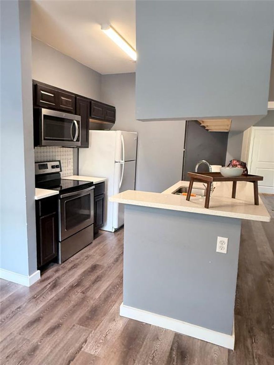 Fabulous opportunity for investors or new homeowners to own in a great neighborhood in Lake Highlands. SELLER OFFERING $1000! FOR CLOSING COSTS if offer is received by May 15th. Fully renovated in 2019; soft-close cabinets, quartz countertops, laminate floors, designer lighting. Unit has great features, like no carpet, living room high ceilings, wood-burning fireplace, private patio off the master, assigned covered parking space, in-unit stackable laundry and refrigerator included in the sale. Very private, below is a garage and no units above it. Pool views from living area. Walk to Mi Cocina or shopping center down the street, ride your bike on the White Rock lake trails right behind the complex. Easy access to Hwy 75 & uptown Dallas.