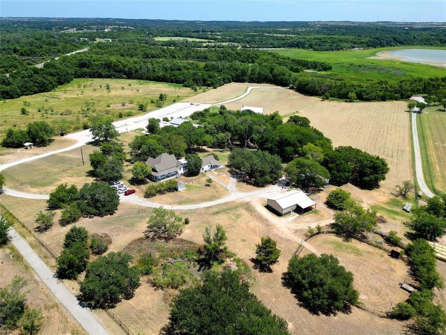 Endless possibilities & great income opportunity for this beautiful event venue. Gated entrance greets you to this charming 21 acre property with Vintage Chapel, Old World Venue, 2 Guest Homes, Pool, 30x50 Metal Barn & Garden Area. 6865sqft Venue crafted with stucco, ornate wood columns, corrugated metal, reclaimed wood & more add to its charm & holds up to 300 guests. Other features include grand rm with massive fireplace, private bridal & groom suites each with hand scraped hardwoods, granite countertops, elegant sitting & dressing areas, prep kit with ice maker, indoor outdoor sound system, outdoor WBFP & seating area overlooking pond with water feature meandering past venue for a picturesque setting at the chapel. Ample parking & plenty of space for any multi purpose facility. Vintage home has wrap around pebble tech porch, 12ft ceiling in hallway, 8in baseboards throughout, beaded board walls, 2 bedrooms & 1 bath & 22x18 screened in porch & 2 bedroom 1 bath guest home all overlooking pool perfect for B&B's! Currently used as a Wedding Venue. Continue as a successful Wedding Venue or bring your imagination & dreams to create your own unique & successful enterprise! Call for your private showing today!