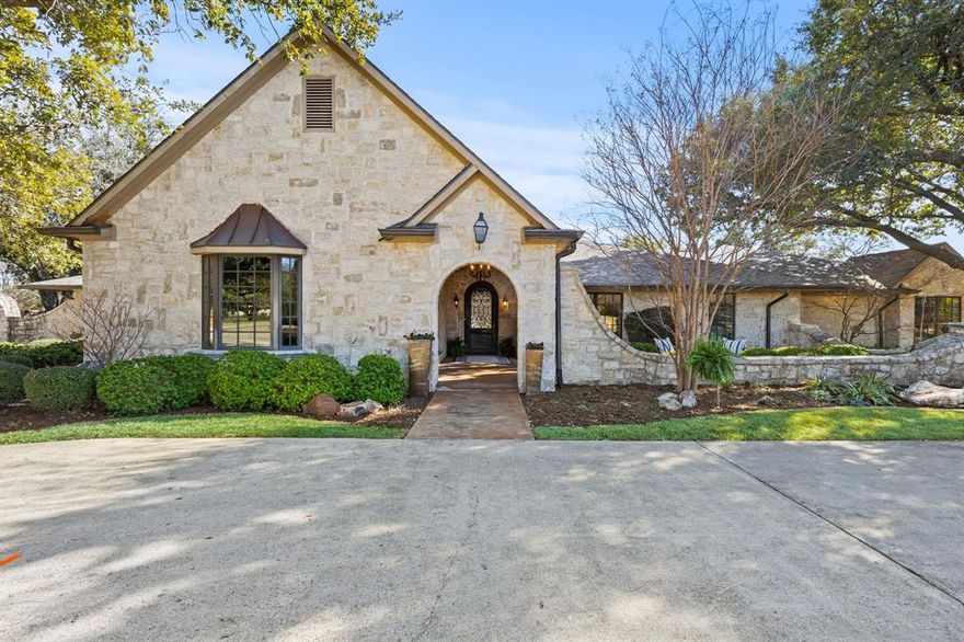 Located in the highly desirable Russwood Acres, this stunning 5-bedroom, 6.1-bathroom estate offers an impressive combination of timeless elegance and modern updates. Set on half an acre, the home features expansive living spaces, abundant natural light, and high-end finishes throughout. The gourmet kitchen, renovated in 2018, includes dual islands, a commercial-grade range, and built-in Sub-Zero refrigerator, making it perfect for entertaining. The primary retreat is a spacious 28' x 20' suite with a gas fireplace and relaxation-flex space. The resort-style backyard boasts a heated pool and spa, cascading water features, turf, an outdoor kitchen, and living areas designed for gathering. Additional features include a bonus flex space upstairs perfect for an office, gameroom, craft room or gym; pier and beam foundation, a 3-car garage with extra storage, and both circular and side driveways providing ample parking. This exceptional home is just minutes from top private schools, shopping, and dining, offering easy access to the North Dallas Tollway, Love Field, and DFW airports. A rare opportunity in one of Dallas' most coveted neighborhoods.