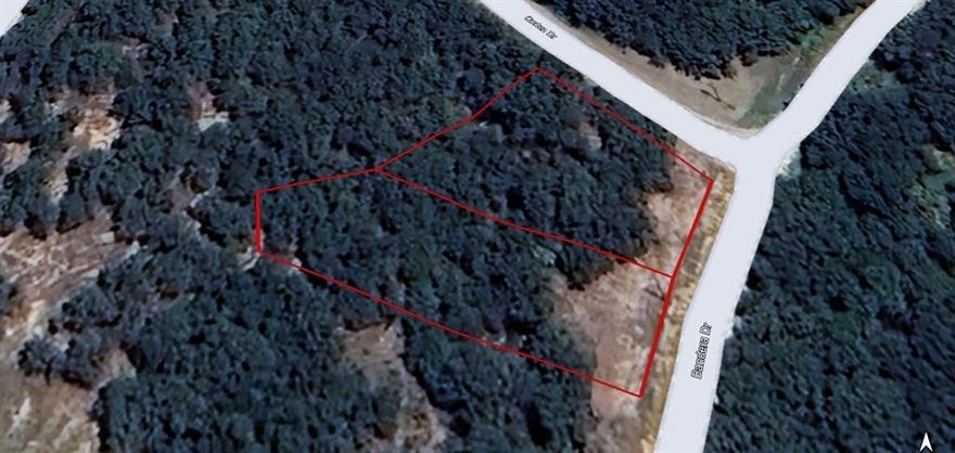 Beautiful corner lot build site with lake views and mature oak trees. Property is 2 lots combined totaling .58 acres. It has large out cropping of rocks and a deep rocky creek runs beside it. Situated right down the street from the boat ramp and shoreline. lots are surrounded by the tranquility of nature as you will often see deer all around the property. Nocona Hills offers a 24-hour guarded gated community with access to two private lakes (one listed as top 5 Bass fishing in Texas)a community boat ramp and dock, as well as an 18-hole golf course with driving range, an airstrip, campgrounds with RV sites, and more. Utilities include co-op water and electric already at street. Fiber optic high speed internet is also available. Nearby surroundings include historic downtown Nocona, a winery, brewery and just a short drive to Saint Jo, Muenster and popular Casinos. Owner has multiple lots available to choose from, please contact listing agent for details. The Club house is under remodel along with the pool such an exciting new Update for the community.