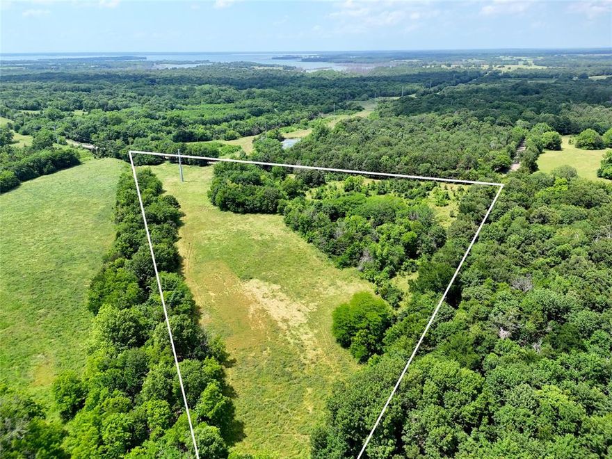 Here is your chance to make a beautiful property your own. Opportunity to build your estate in a way that offers seclusion or a home site that can stand out against a stunning landscape. This property offers mature hardwoods that shelter a small pond and scattered thickets that hide a breathtaking meadow from view of the road. This property backs North Texas Municipal owned land along the creek providing an essential wildlife corridor for the local populations of whitetail and turkey. Just minutes from the FM1396 boat ramp, Bois D Arc Lake is only a short ride away. This is a desirable tract in a thriving area.