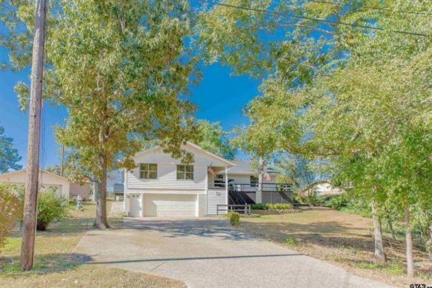Live your best life in one of East Texas' most coveted gated communities! Hideaway Lake features three lakes boating, fishing, and swimming, plus two tennis courts, an on site restaurant clubhouse and more events and activities than you can dream of. It's like living on a cruise ship! And that's just the lifestyle...wait until you see the totally renovated house! There's a front and back deck, perfect for entertaining, or to enjoy your morning coffee or glass of wine while taking in your beautiful golf course view. A short walk takes you to the clubhouse for cocktails or a great meal with your new neighbors. You'll have plenty of room for family or sleepover guests with 4 bedrooms and 3 full baths, with a split bedroom arrangement and a big bonus room downstairs. The living room kitchen is open with a breakfast bar for additional seating to the dining area. There is a wood burning fireplace for chilly days and roomy showers in each of the three baths. This house is a must see, so call today for a tour!