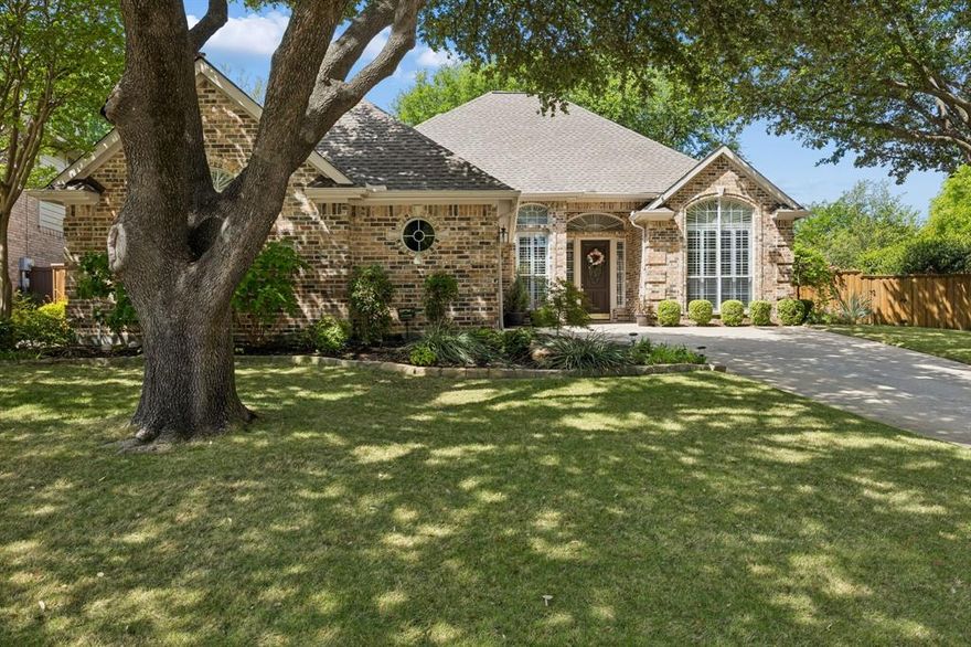 Stunning home with gorgeous landscaping in the coveted Stonebridge Ranch community. This 3-bedroom home shows pride of ownership inside and out. Beautifully landscaped beds, mature trees and flagstone patios and walkways turn the backyard into a paradise inside the city. The backyard benefits from the front entry access, but don't let that fool you. The drive is j shaped so that the garage is not part of the aesthetic. Step inside the wood and glass front door to the welcoming entry and find handsome 18in tile that runs through the entire home. The spacious living room overlooks the backyard with windows framing the fireplace. The home is graced with glistening windows bringing in abundant natural light. The floorplan is somewhat open with the living room flowing into the breakfast nook that is surrounded by windows. The kitchen offers granite countertops and backsplash, stainless appliances and easy access to the dining room. Find plantation shutters throughout the home, arched openings and crown moulding in many rooms. The primary suite has views of the backyard and an en suite spa-like bath and fantastic 11 x 10 walk-in closet. The secondary bedrooms are split. One of the secondary bedrooms is more of a flex space as it could serve as the perfect home office with french doors, crown moulding and closet with built in shelving. Nice size utility room and storage in the garage complete the interior of the home. Step out back to escape to your own oasis of calm. The backyard offers many trees including Japanese maples, mature live oaks, pine, crepe myrtle and more! The stone bordered beds are lush with flowers, greenery and shrubs. Such a peaceful setting! Stonebridge Ranch has many amenities including parks, walking trails, community pools, and of course, the Stonebridge Ranch Country Club. McKinney ISD. Convenient to shops, dining and the historic downtown McKinney Square.