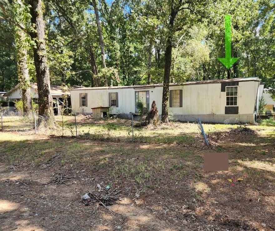 Owner financing available. Investment opportunity. 2 bed, 2 bath fixer-upper mobile home on 0.24 acre. Partially fenced corner lot with mature trees. 2-car carport & separate shed. SW of Mooringsport & Caddo Lake. This property is not in a flood zone.