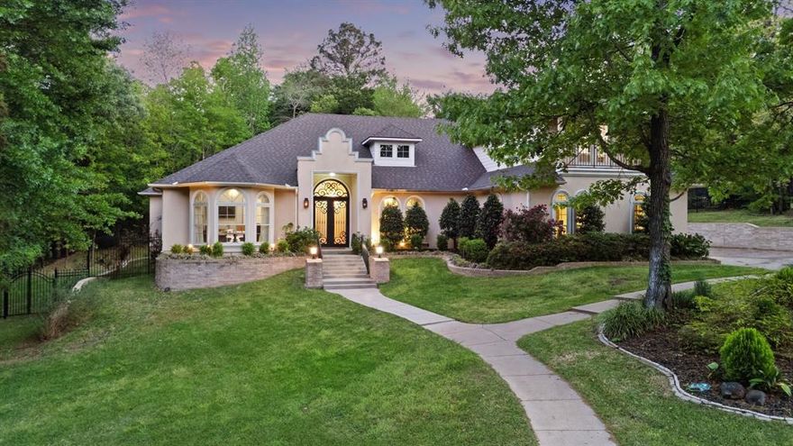 Tucked among beautiful, mature trees on nearly an acre in the gated Stonegate community, this immaculate luxury home offers 5 bedrooms, 5 baths, and 4,120 square feet of thoughtfully designed living space. With its lush surroundings, the property feels like a private retreat in the woods, all while being just minutes from the conveniences and amenities of South Tyler and located within the highly sought-after Whitehouse school district. Inside, soaring ceilings and expansive windows fill the home with natural light, highlighting multiple living and dining areas, including a spacious upstairs game room with a full bath that could easily serve as a sixth bedroom. Extensive woodwork throughout the main living areas - including detailed column trim, a beautifully crafted fireplace, and crown molding - adds warmth and character throughout the home. The oversized primary suite is a true retreat with French doors leading to the patio, dual closets, and a stunning ensuite featuring dual sinks, a jetted tub, and a large walk-in shower. Designed for both everyday living and entertaining, the kitchen offers JennAir appliances, a center island, bar seating, and abundant storage, opening effortlessly into the main living spaces. Generously sized secondary bedrooms include walk-in closets and a Jack-and-Jill layout, offering comfort and flexibility for family or guests plus enough space for an at-home office. Outdoors, enjoy pristine landscaping, a balcony, and expansive patio space - perfect for entertaining or simply relaxing in the peaceful, tree-lined setting. The home also features a recently replaced roof, adding peace of mind to its long list of desirable features. This property truly blends luxury, space, and a serene setting in one exceptional package. Schedule your showing today!