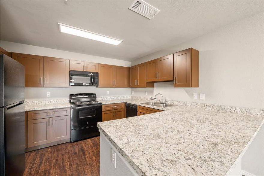 Welcome to your modern condo in the heart of Dallas! This beautiful 2-bedroom, 1-bath condo offers the best of low-maintenance living with high-style finishes throughout. Fully reconstructed in 2021, this unit features an open-concept living area with wood-plank vinyl flooring and an electric fireplace for cozy evenings in. The updated and open kitchen includes stylish cabinets and a breakfast bar, while the spacious primary bedroom offers a walk-in closet and private access to the balcony. Enjoy the convenience of an in-unit washer & dryer and move-in-ready interiors. Located in a gated community with a pool, clubhouse, and tennis courts, plus covered parking and easy access to 75 and Northwest Hwy, this home combines comfort, functionality, and location. Just minutes from shopping, dining, and Dallas hot spots, this one’s a must-see!