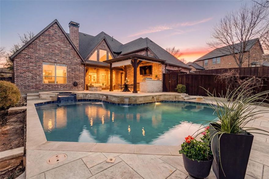 Welcome to your backyard retreat designed for everyday living and memorable gatherings - all in the heart of McKinney. Pride of ownership shines throughout this home, which offers over 4,000 square feet of space with a layout that flows effortlessly from room to room. Natural light fills the home, highlighting soaring ceilings, warm finishes, and inviting living spaces. The true standout is the outdoor experience—featuring a pool, built-in outdoor kitchen, firepit, and multiple areas to relax or host. This backyard oasis is made for entertaining or simply unwinding in style. It's a setting that stands out from the rest. Inside, you’ll find a well-appointed kitchen featuring Thermador appliances, multiple living and dining areas, a private office, and generously sized bedrooms including a spacious primary suite and a second primary bedroom on the first floor. Downstairs windows are enhanced with custom Hunter Douglas Roman shades. Recent updates include fresh Zoysia sod in the front, side, and backyard, creating a clean, well-maintained outdoor space. A generous 3-car garage, complete with a Tesla charging station, adds everyday convenience. If you’ve been looking for a home that offers both comfort and a standout outdoor lifestyle, this one is worth a closer look.