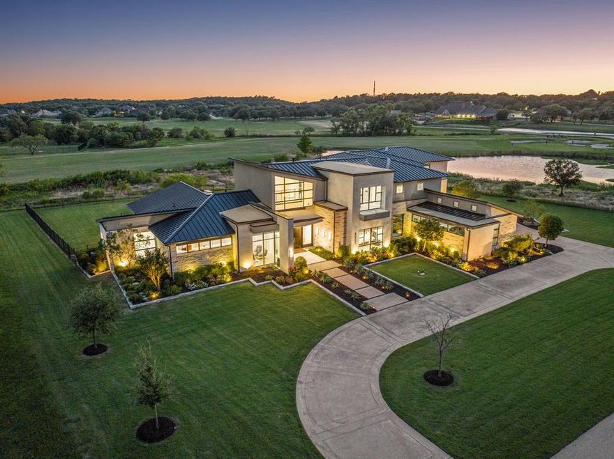 Spectacular Texas modern home on the fairway of guarded & gated Tour 18.The entry features a soaring two-story ceiling and a floating staircase. The great room boasts walls of windows with a view of the golf course. Gourmet kitchen with Thermador appliances, Marble island, designer lighting and soft close cabinets.The downstairs includes a media room and a show garage visible from the living area. Designer finishes, large windows, and amazing views from every room! The Master suite offers a luxurious retreat with a spa-like bathroom, dual vanities, oversized shower and custom closet.  Upstairs, you'll find three spacious bedrooms, a game room, a media area, a wet bar, a balcony, and a huge bonus room perfect for kids. Outdoors, enjoy a true paradise with an infinity-edge pool, an outdoor kitchen, covered sitting areas, a linear fire pit, all overlooking the golf course and beyond. A six-car garage and quick accesses to the Country Club completes this exceptional home.