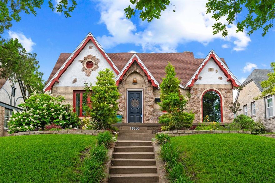 Located in sought-after Hollywood-Santa Monica and zoned to Lakewood Elementary School, this Storybook Tudor blends timeless architecture with a floorplan perfect for today’s living. Full of natural light, and historic character, the home offers the perfect mix of historic charm and modern functionality including a true Primary En Suite with walk in closet and private bath.  A rare find for the neighborhood, the property also features an oversized 7-year-old garage with extra-high 10-foot ceilings and a large floored attic for exceptional storage—offering a truly usable 2-car garage setup that is hard to find in Hollywood Heights.
An enclosed front sunroom creates an ideal flex space for a home office, reading lounge, or workout area and sets the tone for the inviting feel throughout the home. Inside, original millwork, plaster walls, hardwood floors, stone accents, and a dramatic stone fireplace add warmth and personality, while the center hall features a rare original built-in phone niche and cedar closet.
The kitchen combines style and function with maple cabinetry, granite countertops, center island, ceramic flooring, backyard access, and a distinctive tin ceiling. The spacious primary suite offers abundant natural light, and an updated bath with cherry cabinetry, quartzite countertops, and decorator finishes. The hall bath features a custom vanity, clawfoot tub, porcelain tile floors, and ceramic wainscoting.
The backyard is designed for relaxing and entertaining with a patio, architectural pergola, garden area, and sprinkler system.
Ideally located near White Rock Lake, the Santa Fe Trail, Downtown Dallas, Baylor Medical District, neighborhood parks, golf courses, and all the dining, coffee shops, and shopping Lakewood has to offer.