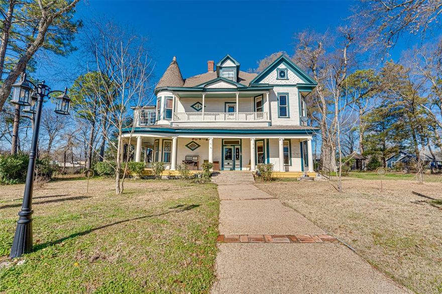 Step into history with this treasured landmark, built in 1903 and situated on approximately 2 acres in the heart of downtown Mineola. This remarkable property features 3 historical markers and showcases the timeless craftsmanship and character that can only be found in this era. A large entry hall welcomes you with a grand staircase, setting the tone for the elegance throughout. The main residence offers 7 oversized bedrooms, formal and informal dining areas, and a bonus room on the third floor, providing exceptional flexibility. A classic wrap-around porch invites you to relax and enjoy the charm of this historic setting. Offering residential or commercial use, the possibilities are endless—private estate, professional offices, boutique business, event venue, or investment opportunity.
In addition to the main home, the property includes a two-story cottage with a 1-bedroom apartment on each level, creating excellent income potential or flexible living space. A large shop and additional garage provide abundant storage and workspace. Rarely does a property of this size, location, and historical significance become available—this is a unique opportunity to own one of Mineola’s most notable homes, toured by many over the years.
