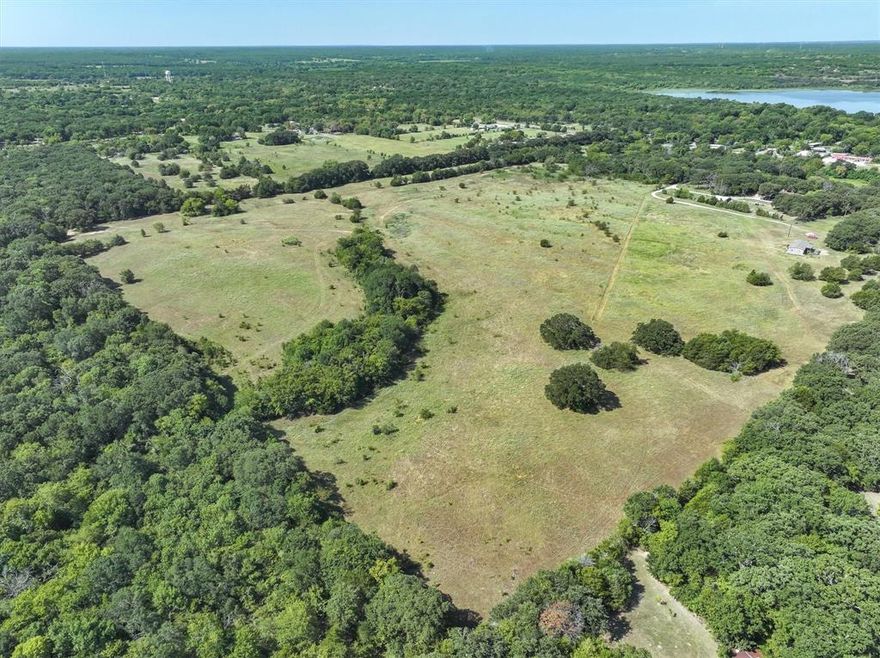 Prime acreage for single family, commercial, RV park, etc.  With 3 different entrances (FM Rd., County Rd and Private Rd., this property offers endless opportunity for any eager developer.  It is located less than one half mile to Lake Tawakoni near Duck Cove Marina.  It can also remain in Ag if buyer chooses to buy and hold.  There are ponds on the property and lots of trees which add to the beauty of the property.  New surveys have been completed recently and uploaded for buyer viewing.  The three entrances are noted on both the surveys and the parcel map.  You must see the property to appreciate the terrain and how close the property is to the lake, as well as the location of the three entrances.