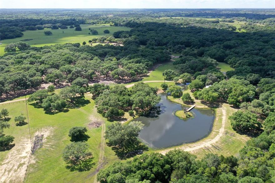 Situated on 85 acres of stunning land, this ranch is known as the Hamptons for Houston Ranch Buyers. Easily accessible from Hwy 71 or Interstate 10, and just an hour from downtown Houston and 90 minutes from Austin, it offers a peaceful escape in the heart of Austin County. The picturesque landscape features beautiful live oaks, a serene pond, and over half a mile of live-water spring fed Schweiner Creek. The property includes two charming cabins, a 1.5 acre pond with an island, outbuildings, a luxurious shooting range. Rolling pastures with split rail fencing, and an Ag exemption, this ranch is ideal for outdoor enthusiasts, hunters, ranchers, and those seeking a tranquil retreat. Surrounded by picturesque landscapes and offering a multitude of recreational activities, this property is a true haven for nature lovers. *Additional acreage available*