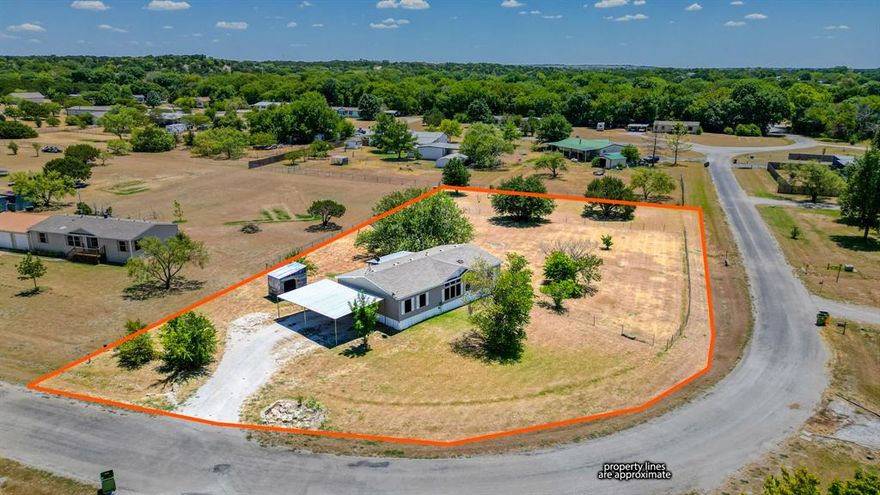 Welcome Home to 373 Kelly Brook Cir in Weatherford Tx! This home is situated on a one acre lot in Kinbrook Estates and is conveniently located just south of town.  With 1,664 square feet of living space, this home features three bedrooms, two bathrooms, a spacious open concept living area, large kitchen with island, dining area off the kitchen and a separate laundry room.  Relax on your covered back porch overlooking an acre of land with a big beautiful shade tree and fenced in backyard area.  There is also a 2 car carport for parking and a small detached storage building on the property. If you've been dreaming of a space for that big garden or just a little breathing room on your own piece of land in wonderful Weatherford Texas, this might be just the one you've been waiting for! Horses allowed!
