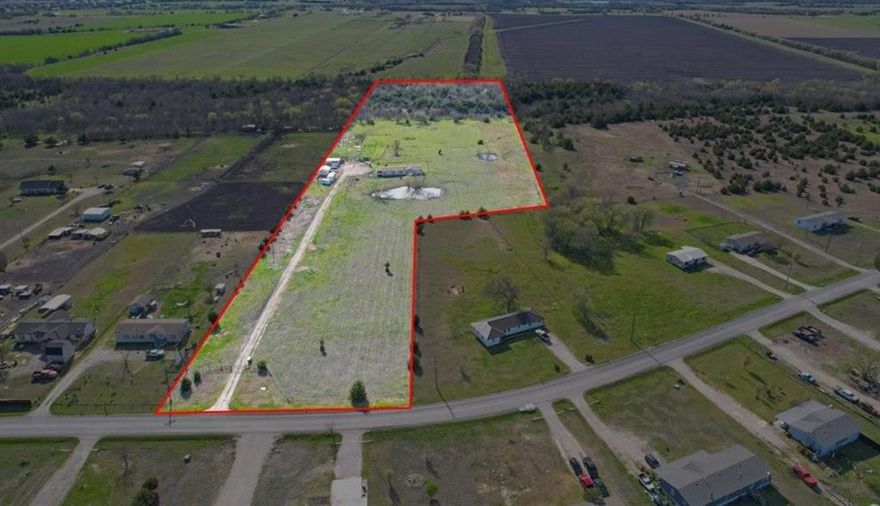 Are you ready to get into the country? Presenting three separate parcels, totaling 12.03 acres, with NO Deed Restrictions, in a prime location, so close to the proposed Collin County Outer loop, about 1.5 miles south of State Highway 380 in Farmersville and about 4 miles North of rapidly developing Josephine. A new survey is in hand. There are 3 adjacent parcels for sale. This property is comprised of 3 parcels, the front two parcels are raw land, about an acre each, and have approximately 225 feet of frontage of County Road 697. The third parcel is approximately 10 acres and contains the home and out buildings. Your horses will love this property as it is fenced, cross-fenced and features a pipe fence arena, with an elevated spectator stand. The barn, with workshop, gives you room from your equipment. The majority of value is in the land, location and utilities; however, the 2128 square foot, 2001 Fleetwood Waverly Crest doublewide manufactured home, features 4 bedrooms, 3 baths and is ready for you to occupy or may be a great rental.  The manufactured home is recognized as real property. The land features pasture in the front while the rear is gently wooded and traversed by the Cowskin Creek. The Houston Black soil is rated for moderate farming and whitetail deer meander about. Th property will not be sold separately. Information deemed reliable but Buyer should perform due diligence. Graphic boundary is approximate.