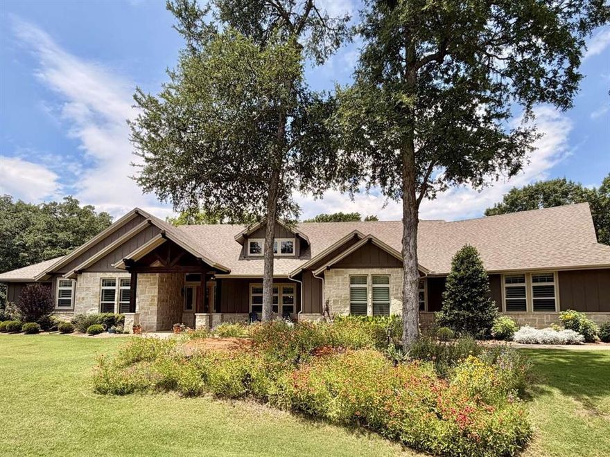 Stunning custom craftsman ranch on 3.72 wooded acres on a quiet cul-de-sac in Aubrey! Located outside city limits yet just 10 mins from grocery stores. This well thought out estate offers the perfect blend of privacy and convenience. Features 4 spacious beds, 3 full baths, and an extra-large 3-car garage. Inside, enjoy rich hardwoods, crown molding, designer lighting, and plantation shutters as well as granite countertops throughout. The chef's kitchen boasts a gas cooktop, extra drawer oven, and a convection microwave oven. Entertain effortlessly with a custom wet bar featuring a premium ice maker and beverage fridge. The large laundry room has extensive cabinetry, and it connects to the primary closet that also connects to the primary bedroom for added convenience. In addition, the extra-large primary closet has an island of dresser drawers. Outside, your private backyard oasis awaits with a sparkling pool, hot tub, 1 covered patio that overlooks the pool, and 1 uncovered patio where you can share a quiet dinner while listening to the resident owls “hoot”. Or, spend your mornings sipping your coffee on the covered front porch! Delight in the scenery: every room in the house has a view! Extras include a whole-house water filtration system and a hardwired exterior security camera system. Total luxury and peace of mind!