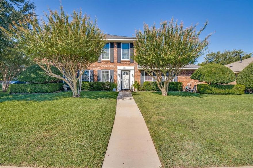 Quiet, established neighborhood boast a spacious four bedroom home designed for a growing family that loves to entertain. The oversized den features a striking wood-burning brick fireplace with an expansive elevated hearth as its centerpiece. Just steps away, the wet bar connects seamlessly to the covered patio, hot tub, diving pool, and serene koi pond—perfect for indoor-outdoor gatherings.  Two generous dining areas offer plenty of room for hosting large groups, while the upstairs family room provides an ideal space for kids or additional activities. A convenient guest half bath downstairs includes a double vanity. The main-level primary suite features a walk-in closet and an ensuite bath with double vanities, a separate tub, and shower. Upstairs, three spacious bedrooms can each accommodate king-size beds. Additional highlights include a privacy-fenced backyard and an extended driveway with room for a boat, RV, or multiple vehicles. Located in a desirable area with school choice options and easy access to the freeway and nearby shopping and dining.