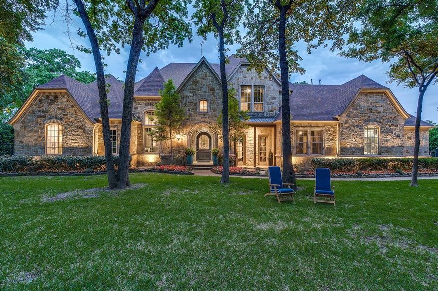 MULTIPLE OFFERS - please submit best and final offer by 5 PM on Monday, May 5. Welcome to 405 King Ranch Road, a magnificent residence nestled in the heart of Southlake, TX. This exquisite home offers a harmonious blend of luxury and comfort across its expansive layout. With five spacious bedrooms, five full baths, and two half baths, each family member will enjoy their own private oasis.

As you step inside, you'll be greeted by a grand foyer that sets the tone for the rest of the home. The open-concept living areas boast high ceilings and abundant natural light, creating an inviting atmosphere for both relaxation and entertainment. The gourmet kitchen is a culinary dream, featuring state-of-the-art appliances and refined finishes. Adjacent to the kitchen, you'll find an additional family room, perfect for casual gatherings, as well as a formal living area for more sophisticated entertaining.

The primary suite is a true retreat, complete with a lavish en-suite bathroom and generous closet space. Entertainment awaits with a dedicated home theatre and a versatile flex space that can serve as a second living room or playroom, complete with a bar. 

Situated on a full acre with a pool, the property is beautifully landscaped and fully gated, providing both privacy and a serene setting for outdoor gatherings or quiet evenings. Car enthusiasts will appreciate the two separate garages with high ceilings, equipped with a car lift that allows for garage space accommodating up to five cars. This home is located in Northwest ISD, one of DFW area's most sought-after school districts, and also provides the option of open enrollment in Carroll ISD. Elegance and comfort awaits at 405 King Ranch Road.