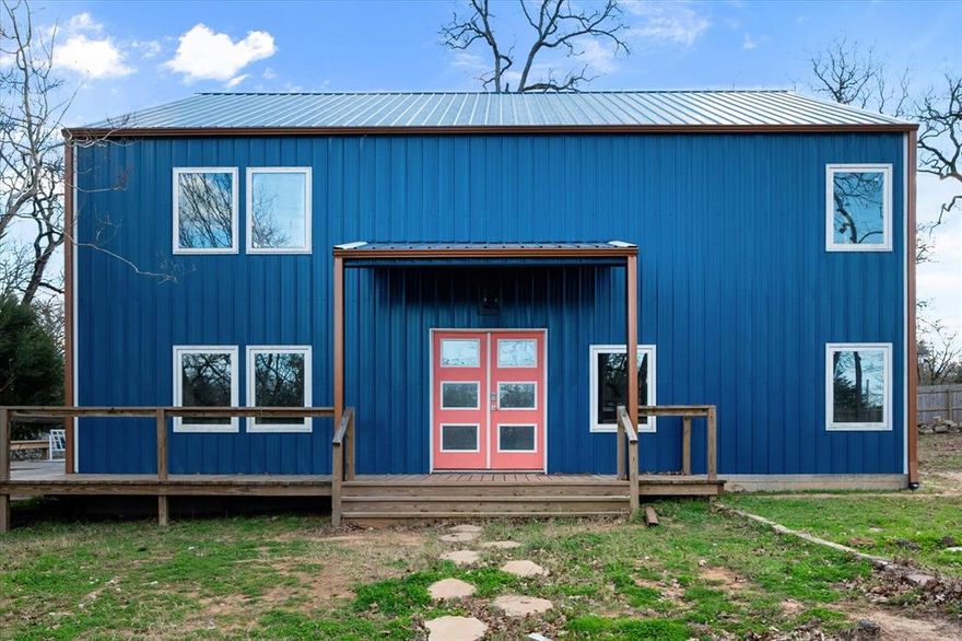 Discover the perfect blend of modern comfort and country charm in this stunning barndominium-style metal home offering 1,919 sq ft on a full acre, located just outside the city limits while still conveniently close to local amenities. Situated in Fairfield ISD, this thoughtfully designed home features soaring ceilings and an open-concept layout that creates a spacious, airy feel, ideal for entertaining and everyday living. The main-level primary suite is a true retreat, complete with a beautiful ensuite bathroom featuring a relaxing garden tub, separate shower, and a custom double-sink vanity. Upstairs, two additional bedrooms provide comfortable accommodations along with a guest bathroom, making this layout both functional and flexible. The kitchen is designed for gathering and entertaining, showcasing a gas range for cooking enthusiasts and a breakfast-coffee bar with a separate sink, perfect for hosting or morning routines. A dedicated laundry and mud room adds convenience, including an additional shower for easy clean-up after outdoor activities. From the tall ceilings to the elegant chandeliers and decorative lighting throughout, this home offers a luxury feel in a peaceful setting. Enjoy the space, style, and functionality of country living with the convenience of nearby amenities—this one is truly special.