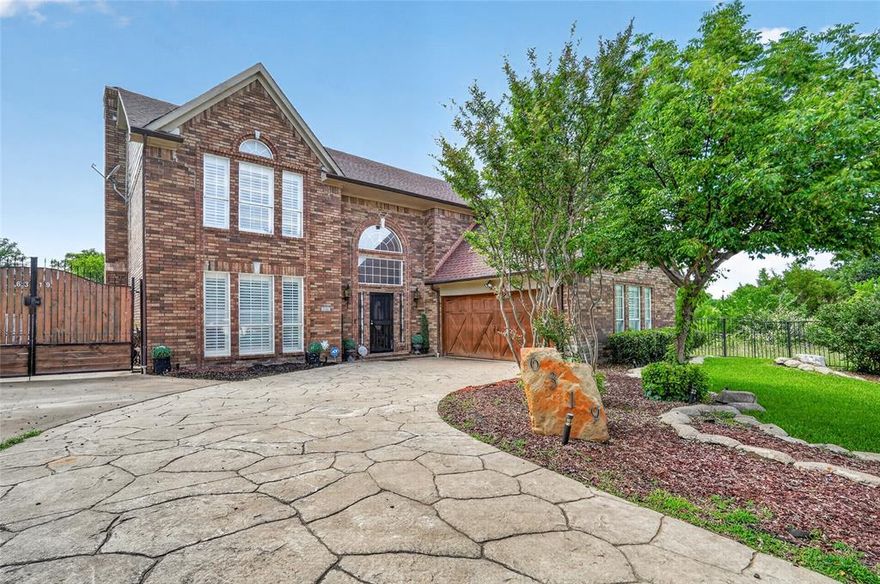 Welcome to 6319 Lake Bluff Drive! A beautifully maintained two-story corner lot home that blends comfort, style, and easy living in a much sought after neighborhood in the hills of Dallas. From the moment you arrive, the charming brick exterior, swing garage, manicured landscaping, and inviting front entry to set the tone awaits. Inside, you’re greeted by an open-concept layout with wood flooring, abundant natural light with wide shutters, and elegant finishes throughout. The spacious living area features a wet bar and flows seamlessly into the kitchen, making it perfect for both everyday living and entertaining. The kitchen is a standout all by itself, offering sleek granite countertops, white cabinetry, stainless steel appliances, and a large island with bar seating—ideal for casual meals or gatherings with guests. The eat in dining and living spaces create a warm, connected feeling while still providing defined areas. The spacious primary suite upstairs with a state-of-the art shower and oversized bathroom is a must see.  Just off the primary bedroom is a bonus room with a balcony and views of the backyard, perfect for sunset views and morning coffee. Step outside to the paved oasis, where you can relax year-round with lots of nature surrounding fire pit areas, cook outs and host lots of fun entertaining around the inground pool. The home’s thoughtful layout maximizes functionality and comfort, with well-proportioned rooms and quality finishes throughout. If you are looking for a move-in-ready home in a desirable community, this property checks all the boxes. Buyer and Buyer's Agent to verify all measurements, schools etc.