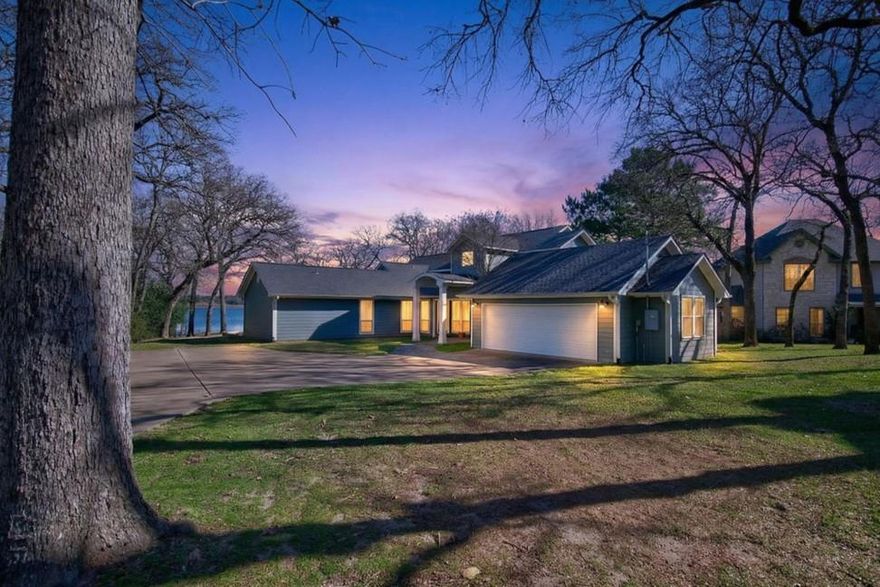 This stunning lakefront estate offers the ultimate in comfort, space, and waterfront living. Featuring 5 bedrooms and 4 bathrooms across 3,994 sq. ft., the home boasts approximately 250 feet of shoreline in a quiet, low-traffic area near the Lake Athens dam—providing privacy and breathtaking views. Designed for both everyday living and entertaining, the open-concept living room flows seamlessly into the kitchen, complete with granite countertops, a pantry, and electric appliances. A separate sitting room with a fireplace showcases beautiful lake views, while abundant storage and closet space are found throughout the home. Two private primary suites—each with walk-in closets and en-suite baths—offer flexibility for guests or multi-generational living. Outdoor living is just as impressive, with a covered back porch, fire pit by the water, and incredible views from nearly every angle. The two-story boat dock includes a boat lift and ample seating, making it ideal for entertaining family and friends. Additional features include a loft area perfect for a second living space or bunk room, a spacious utility room, a large two-car garage, and a new retaining wall completed in 2024. Perfect for large families, hosting unforgettable gatherings, or simply enjoying peaceful lake life, this exceptional property delivers luxury, privacy, and unforgettable waterfront experiences.