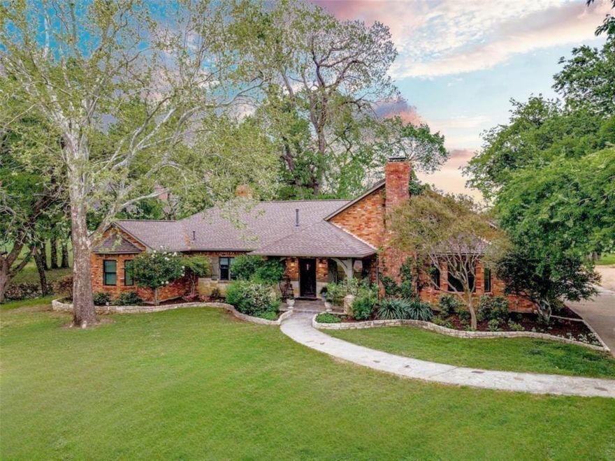 Unrestricted. No HOA. 2.69 breathtaking acres in the heart of Downtown Frisco, a truly one-of-a-kind property.
Tucked beneath a canopy of mature trees, this private retreat feels like a hidden countryside escape, yet it’s just minutes from everything. Stroll through your organic garden, pick fresh plums from your own trees, and enjoy the expansive backyard where Cottonwood Branch Creek winds peacefully year-round. Birds, turtles, fish, fossils, even seasonal ducks, make this a nature lover’s paradise.
Bring your animals and live the lifestyle you’ve dreamed of. The property features a 2-stall barn, two turnouts, tack room, workshop, and a covered equipment garage, perfectly suited for hobbyists, equestrians, or anyone craving wide-open space.
A heated pool with spa, outdoor shower, two fire pits for cozy evenings under the stars, and endless room to entertain.
Inside, the home blends comfort and elegance with four spacious bedrooms and three full baths. The brand new, fully renovated kitchen boasts commercial grade appliances, marble counters, custom cabinetry,  opens to a warm dining area with a fireplace. A large living room, massive utility room, abundant storage, and three fireplaces throughout create both functionality and charm. All the conveniences of city living with the serenity of a rural sanctuary surrounding you. Just minutes from the Dallas North Tollway, less than a mile from the vibrant Frisco Rail District, shopping, coffee shops, restaurants, parks, sports facilities, FCS Stadium, and only five minutes to PGA Headquarters. Country soul. City access. Completely unforgettable and absolutely one-of-a-kind in Downtown Frisco.    Photos coming soon!