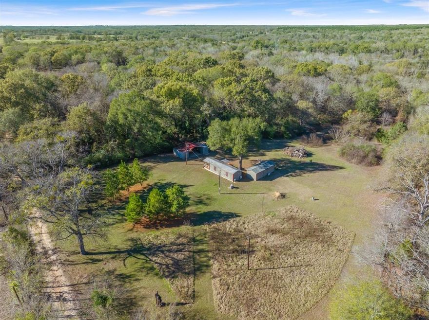 Best East Tx deal- Turnkey and instantly ready to be your home get away for weekend recreation or hunting. One easy hour from Dallas! Very secluded, yet 3 miles from Hwy 80. Almost 20 gorgeous acres of peaceful, rolling land, a 2017 turnkey 408 SF 1-bedroom tiny house with king size bed, with another hide a bed AND recent additional separate bunkhouse with bath. Back deck of tiny home overlooks gorgeous views of trees, thick woods, trails and plenty of wildlife. Rolling land makes for fun ATV rides. Shed and Two 20 ft storage containers stay with the property with equipment cover. Well maintained, side by side, zero turn mower, tools, building materials, furniture, patio furniture, linens, etc. conveys with property. Currently in Ag for wildlife.