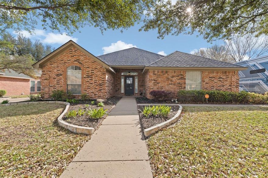 Well-Maintained Fantastic 4-Bedroom Home with POOL in NRH is Ready and Waiting for YOU! Welcoming Entry Opens to Spacious Living Room with Brick WOOD-Burning Fireplace with Mantle, Dining Area and Kitchen. Dining Area features French-Doors that Open to a Sweet PATIO Terrace for Outdoor Coffee, Dining, and Relaxing. Lovely Custom Wood Cabinetry in the Kitchen featuring Corian Countertops, Decorative Backsplash, and SS Appliances... OPENS to Breakfast Room with ISLAND Prep-Space and Serving Bar! PRIVATE Primary Bedroom is located in the Back of the Home and features ENSUITE Bath: Double Sink Vanity, Garden Tub, Separate Shower, and Walk-In Closet. 3 Additional Bedrooms with Full HALL Bath too! Backyard OASIS features Covered Back Patio with Ceramic Tile, Inground POOL, and Outdoor Kitchen Cabana with Built-In BBQ Grill, Serving Bar with Seating for 4, Sound System, and Decorative Lighting!  NO HOA! LOCATION! LOCATION! Walking Distance to Schools!!  RIDE the TEX RAIL to Grapevine OR Fort Worth; Rail Station IS Nearby! Seller has Loving Made Many Updates that INCLUDE: Updated Landscape Lighting (2024), New Pool Filter (2021), New Variable Speed Pool Pump (2019), New Interior HVAC Unit (2024), New Ceiling Fans (2024-except 1 room), New Pool Mastic (2025), New Tile on Back Patio (2025), New Bathroom Faucets (2023), Improved Attic Insulation (2019), New Security System-OWNED (2019), New Microwave Oven (2022), New Garage Door Opener (2020).  Kitchen FRIDGE, Washer and Dryer May CONVEY with Acceptable Offer! MINERALS CONVEY!!