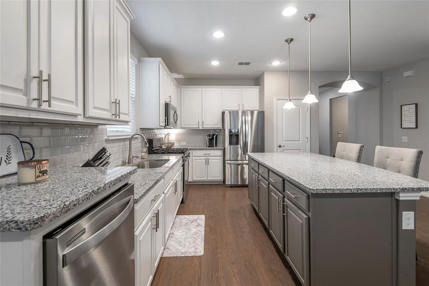 Experience the 55+ Del Webb Lifestyle at Frisco Lakes!! Best-selling Abbeyville floorplan, on a corner homesite, with white maple cabinets, granite countertops, hardwoods throughout, sunroom with covered patio, 4 ft. garage extension, 2nd pantry at utility, tray ceilings, and an upgraded frameless shower with bench. The sellers said their neighbors are the best part of living in their home, so whoever chooses 1897 Plantation Crest Dr. will have great new friends. Residents of Frisco Lakes enjoy first-class amenities including three state-of-the-art amenity centers, fitness areas, indoor and outdoor pools, tennis and pickleball courts, and scenic walking trails around Lake Lewisville. The active social calendar gives you plenty of opportunities to meet neighbors, make new friends, and cherished memories. With on-site dining, weekly happy hours, and over 150 clubs and activities to join, you'll never be bored! This is an exceptional opportunity to secure the lifestyle you deserve.